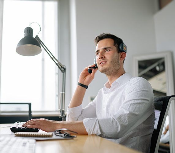 man talking on computer man talking on computer