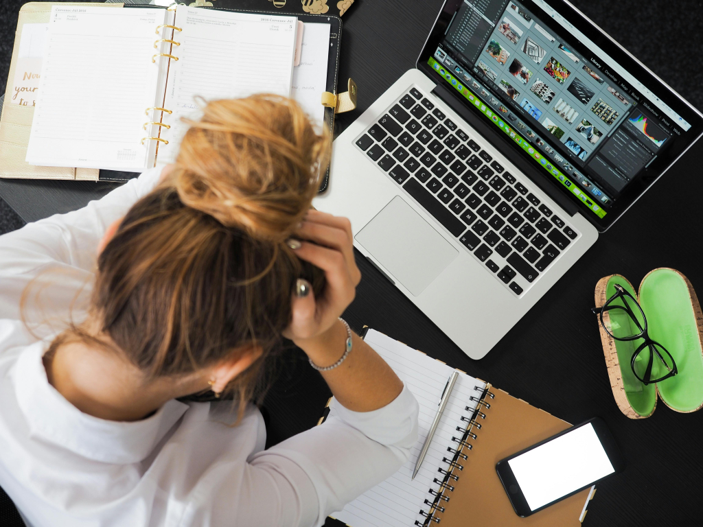 A frustrated business owner experiencing slow internet speeds.
